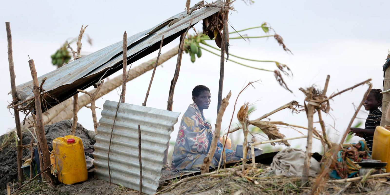 A displaced woman sits at her improvised shelter in the Buzi region after the passage of cyclone Idai in central Mozambique, 27 March 2019. A displaced woman sits at her improvised shelter in the Buzi region after the passage of cyclone Idai in central Mozambique, 27 March 2019.