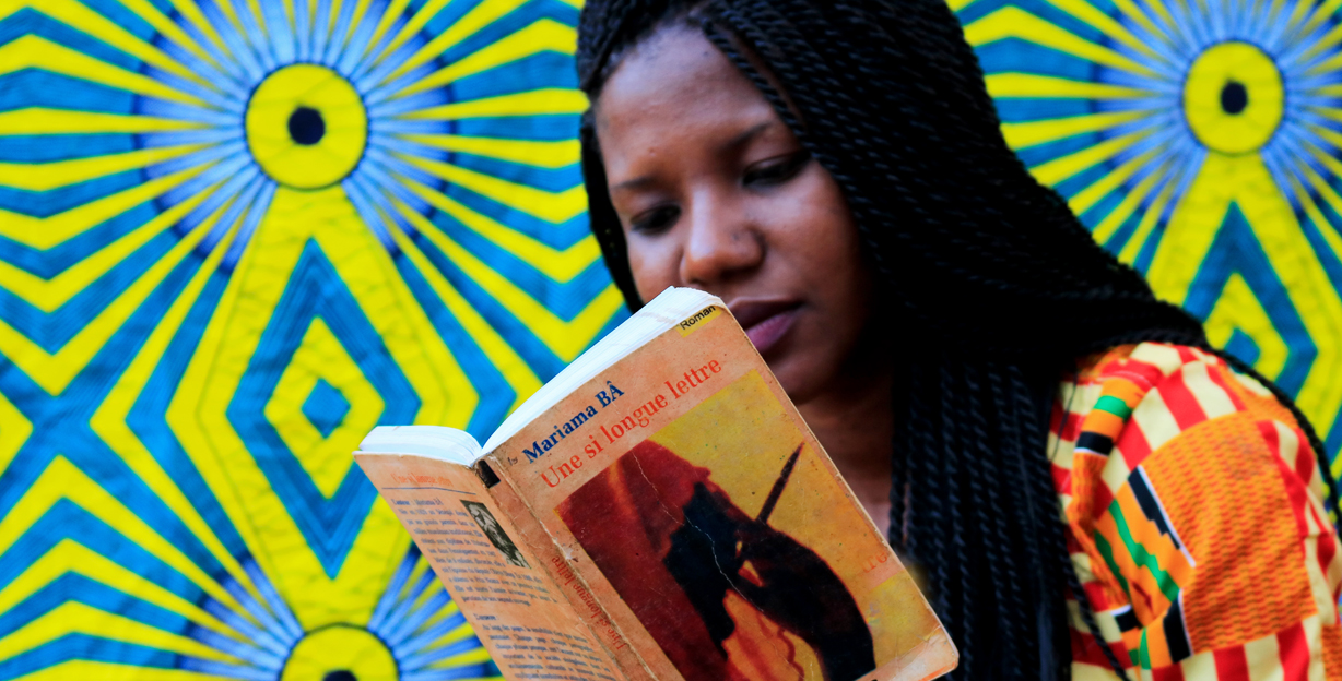 Woman reading Une si longue lettre, Mariama Bâ’s award-wining 1979 feminist novel. Photo courtesy of Tenin Samake. Woman reading Une si longue lettre, Mariama Bâ’s award-wining 1979 feminist novel. Photo courtesy of Tenin Samake.