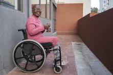 It’s a sunny day and wheelchair user Makgosi Letimile sits behind the wall that separates her building from Trill Road, Observatory. This is the only place she has easy access to in her neighbourhood.