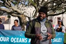 Author in front of banner