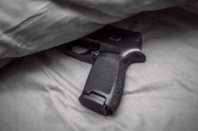 gun in the bed