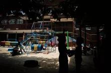 Children playing outside a shelter for abused women and children