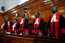 Kenya's Supreme Court judges arrive at the court room before delivering the ruling that nullified the election.