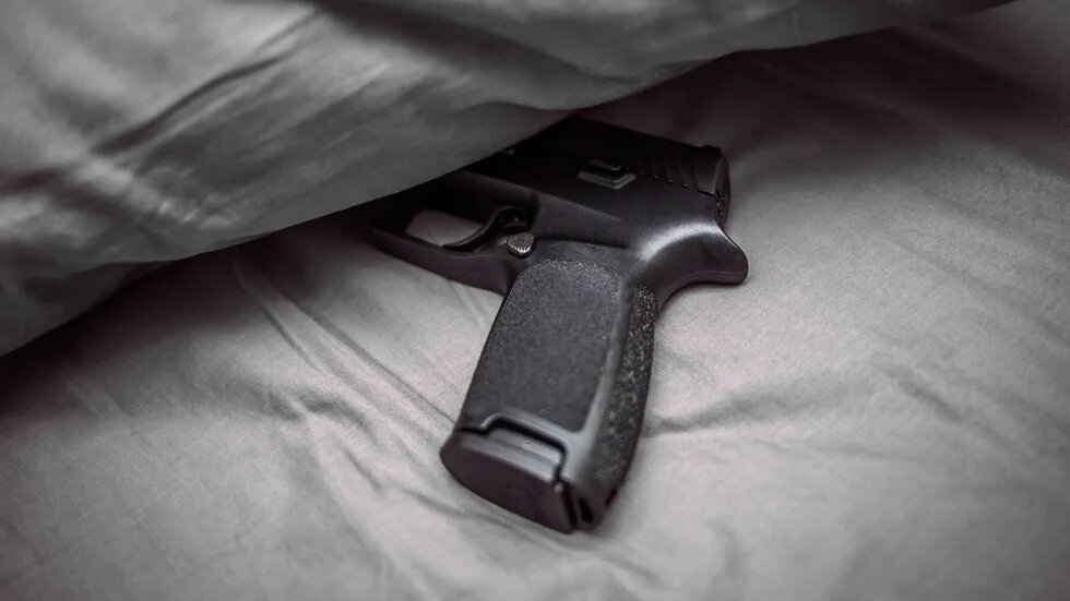 gun in the bed