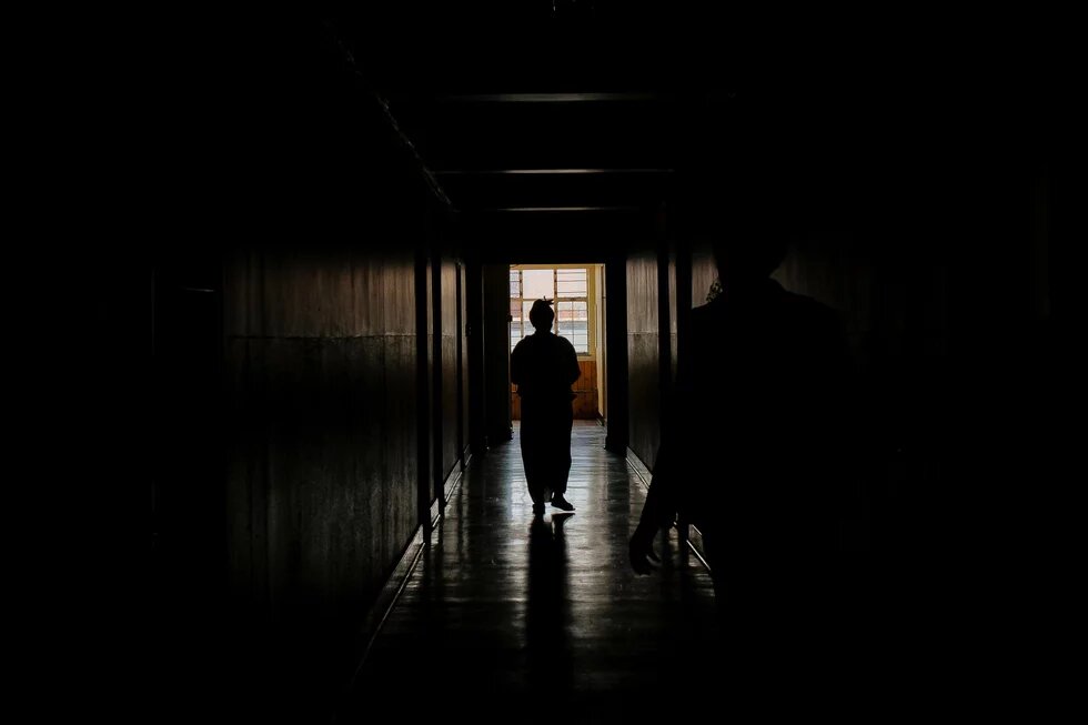 Women walking down a corridor at a shelter in Gauteng Women walking down a corridor at a shelter in Gauteng