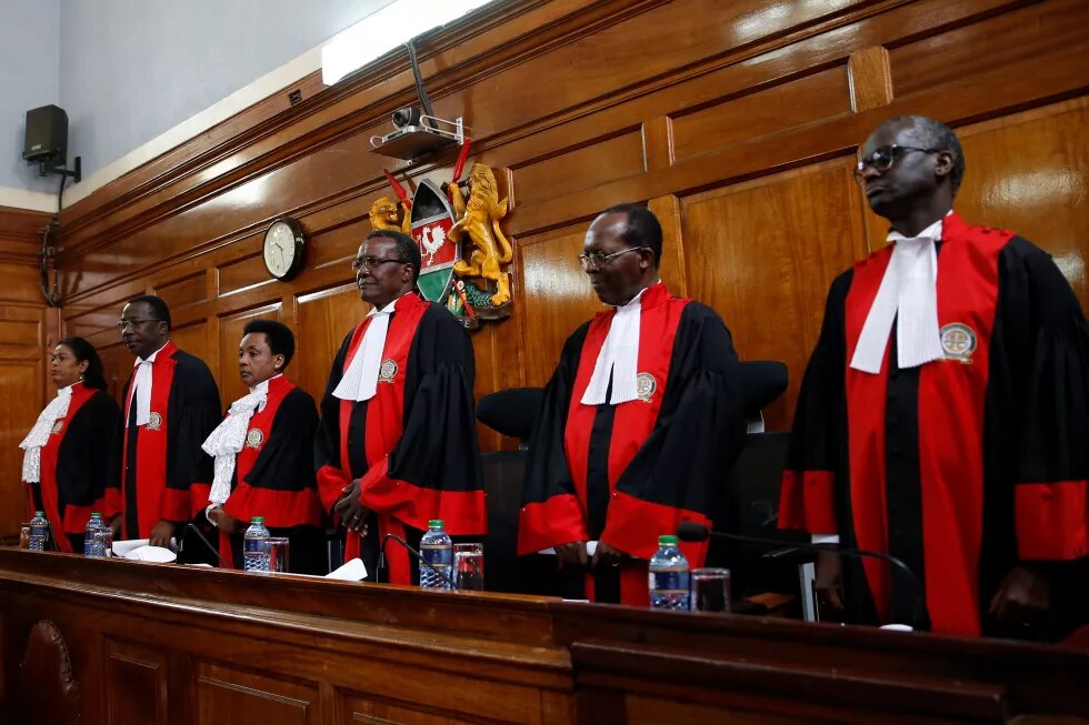 Kenya's Supreme Court judges arrive at the court room before delivering the ruling that nullified the election.